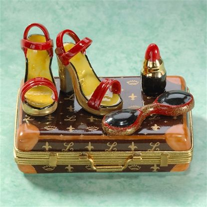 Picture of Limoges Red Sandals and Lipstick on Brown Suitcase Box
